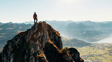 Person at the top of a mountain