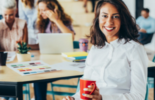 Woman smiling in a conference room